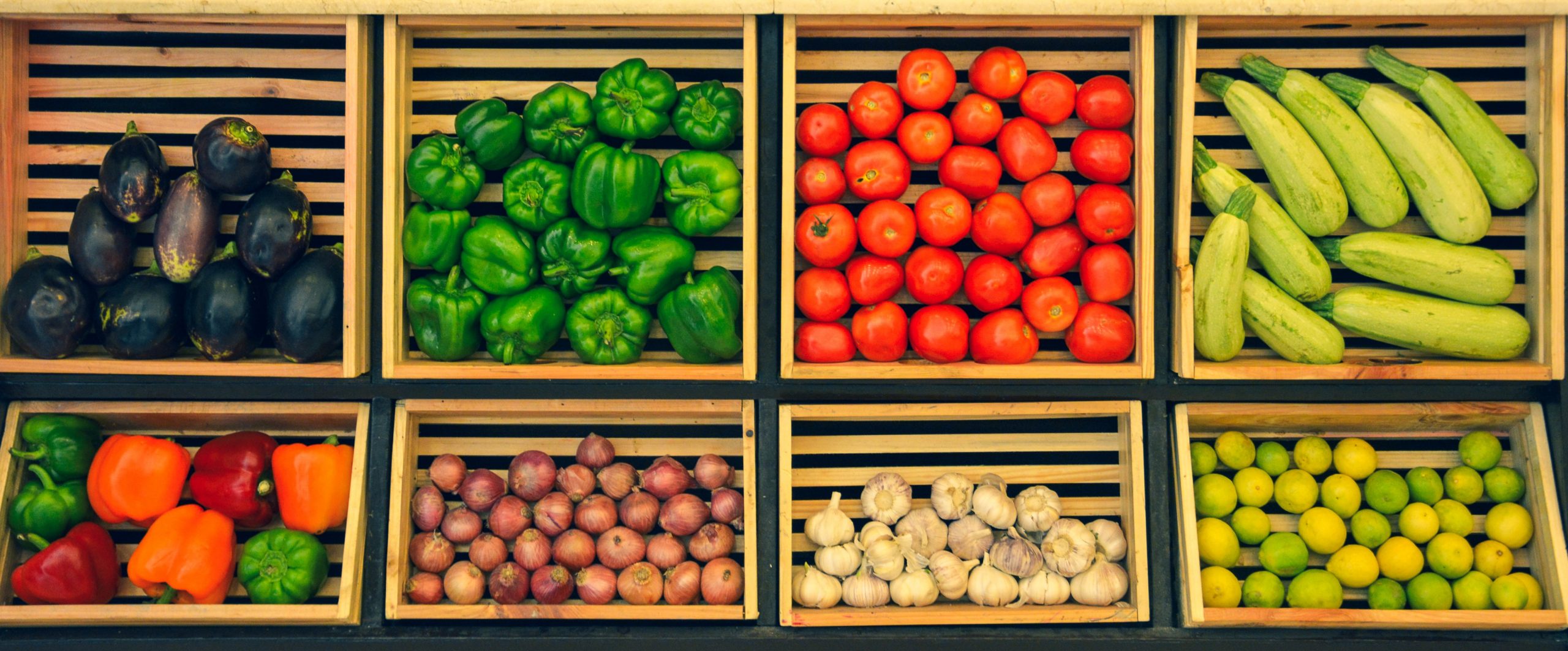 Fresh vegetables on shelving.